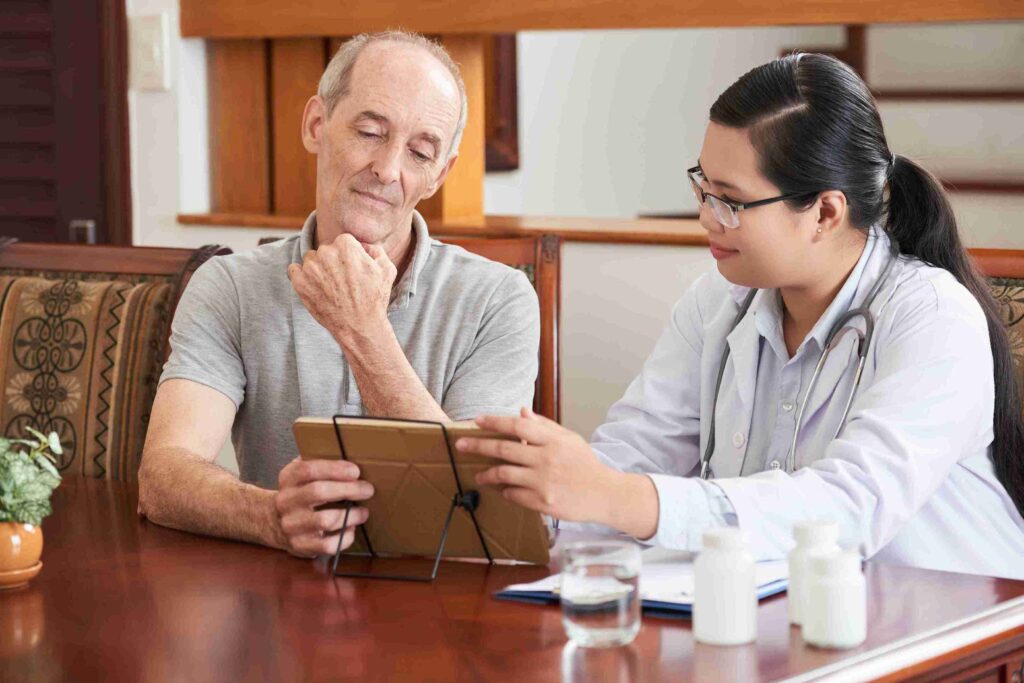 doctor showing test result elderly