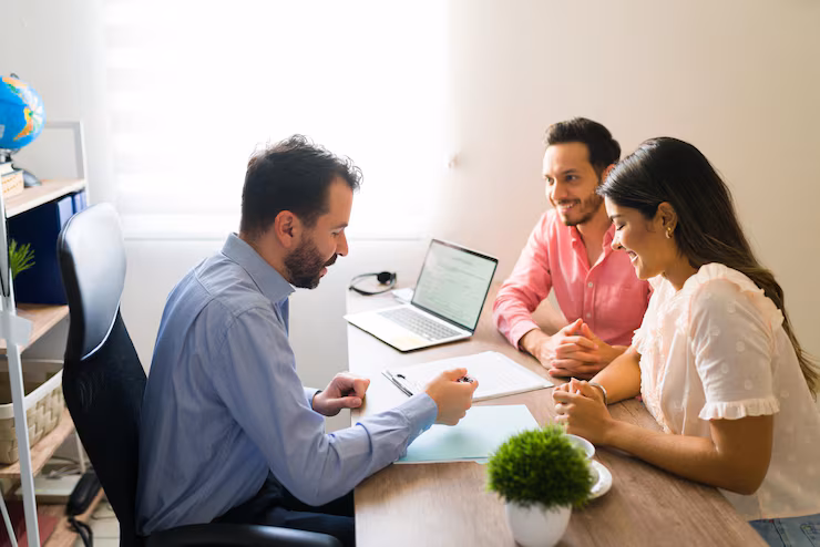 young couple with financial advisor